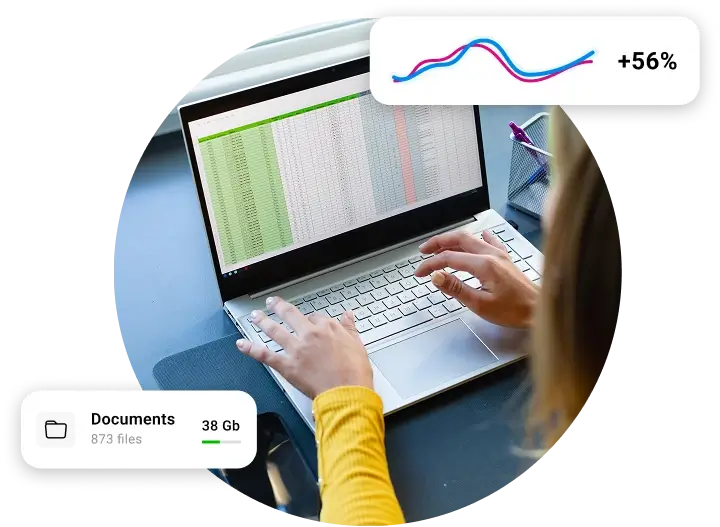 A person's hands typing on a laptop with a spreadsheet on the screen, along with graphics showing a line graph with a "+56%" increase and a folder icon with file storage details.